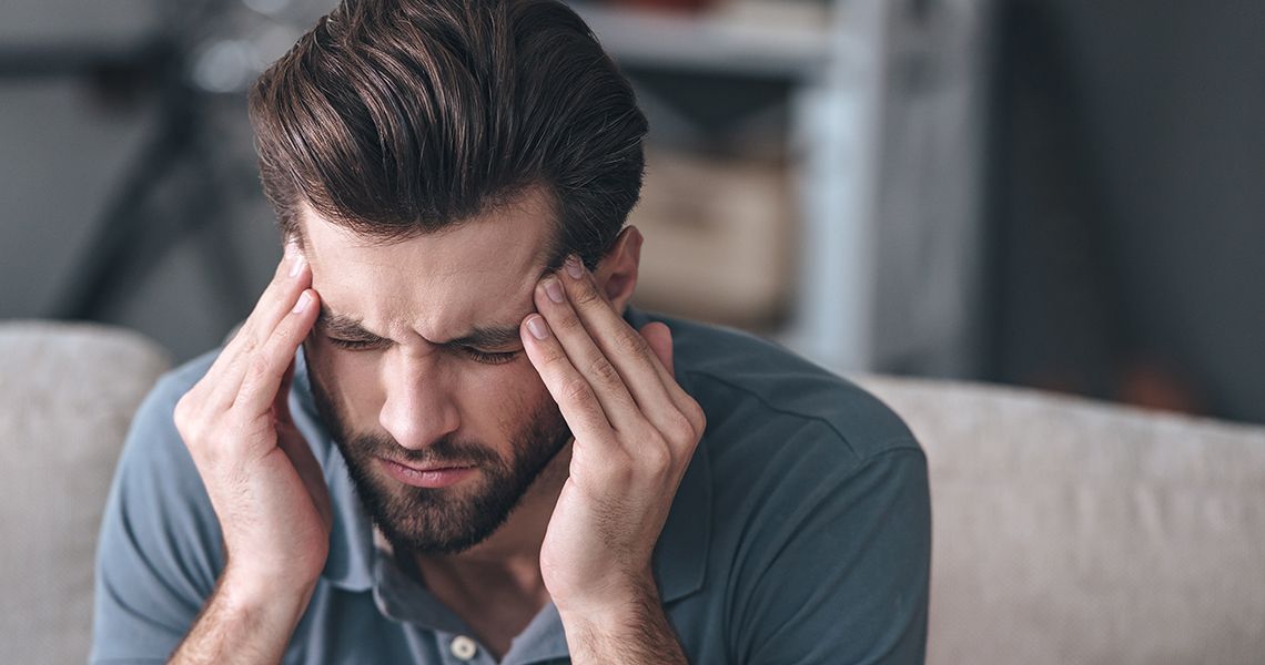 Man holding his head