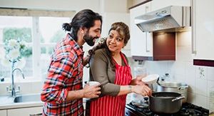 Two people cooking in the kitchen