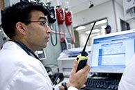 Doctor communicating via walkie talkie