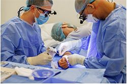Surgeons doing hand surgery