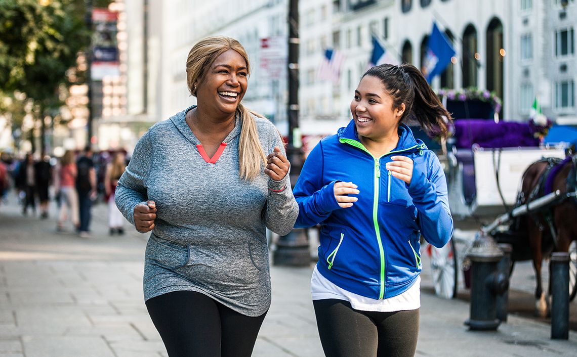 two people running and smiling