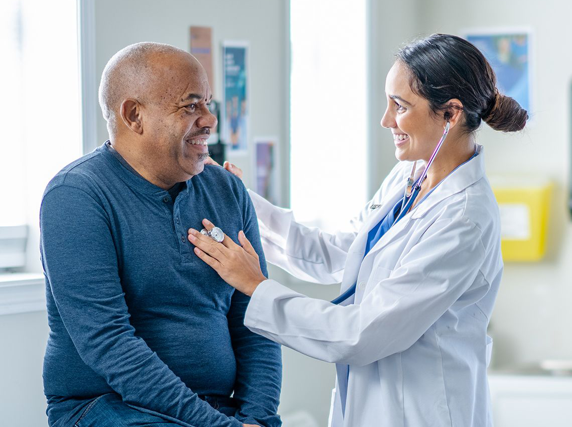 doctor listening to a patient's heart beat