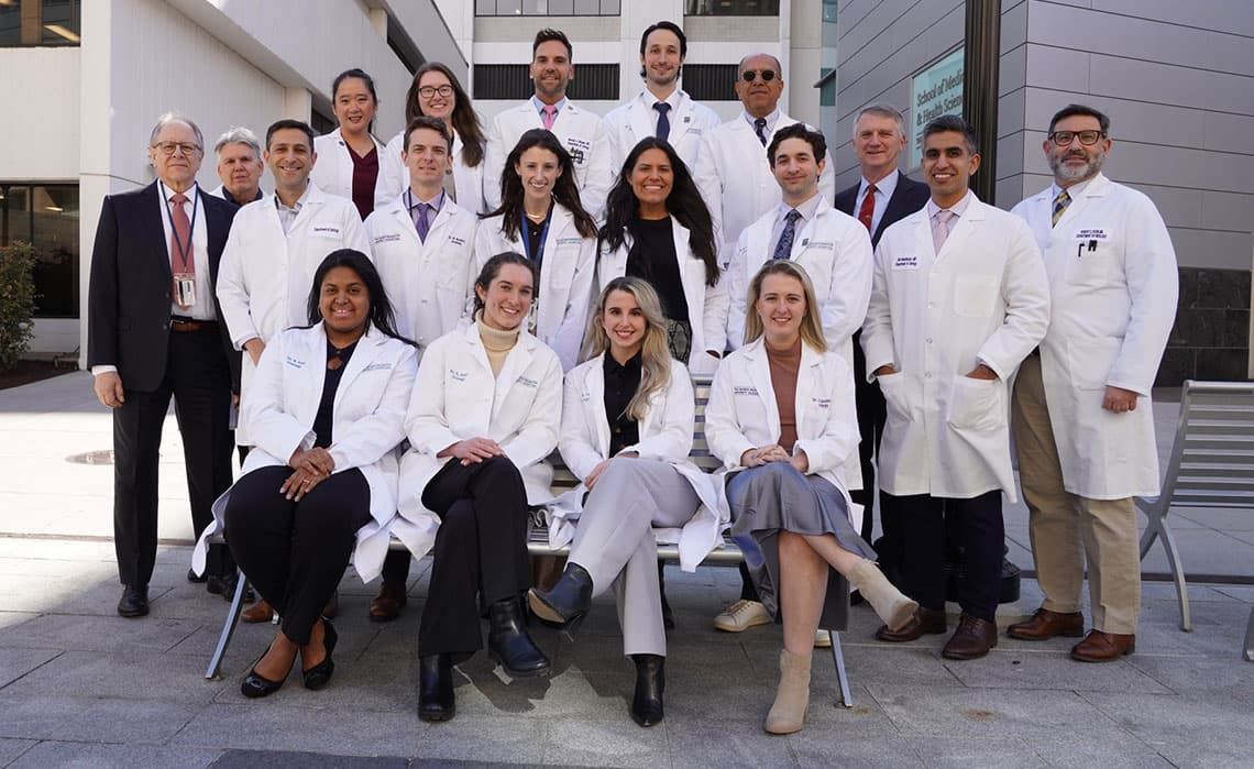 The Urology department faculty and residents standing in front of Ross Hall