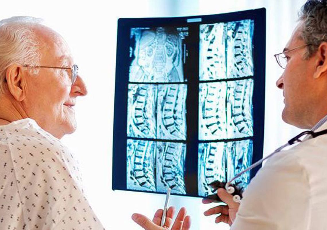 doctor looking at a scan with a patient