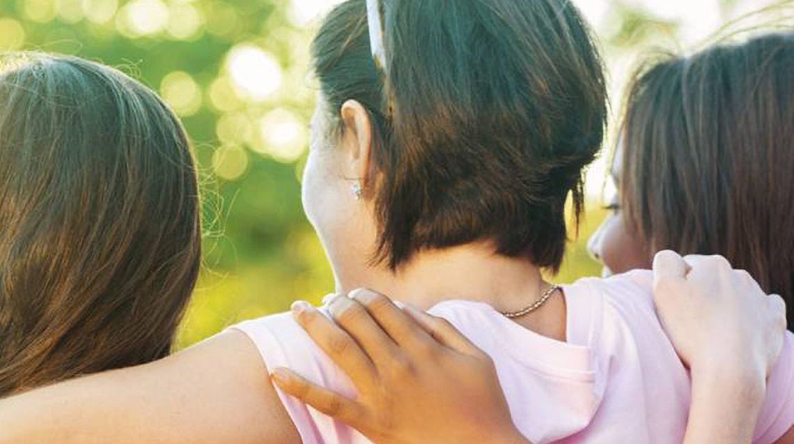 three women hugging