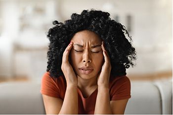 Person holding their head