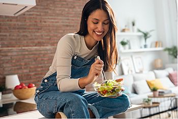 Person eating a salad